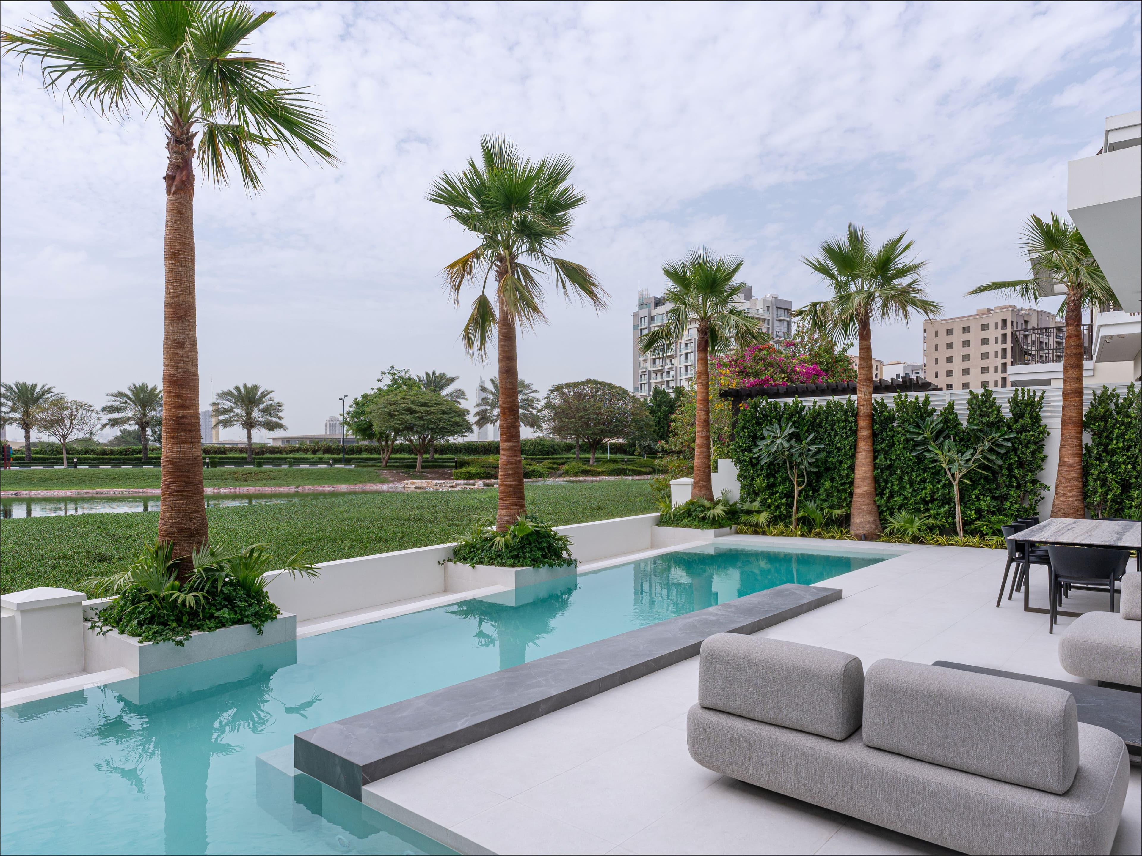 Luxury landscaped garden and swimming pool designed by Better Gardens for a UAE residential property.
