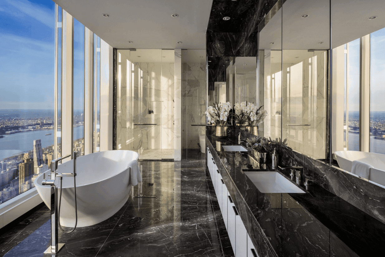 Bathrooms are finished with imported natural stone, custom millwork and premium fittings.