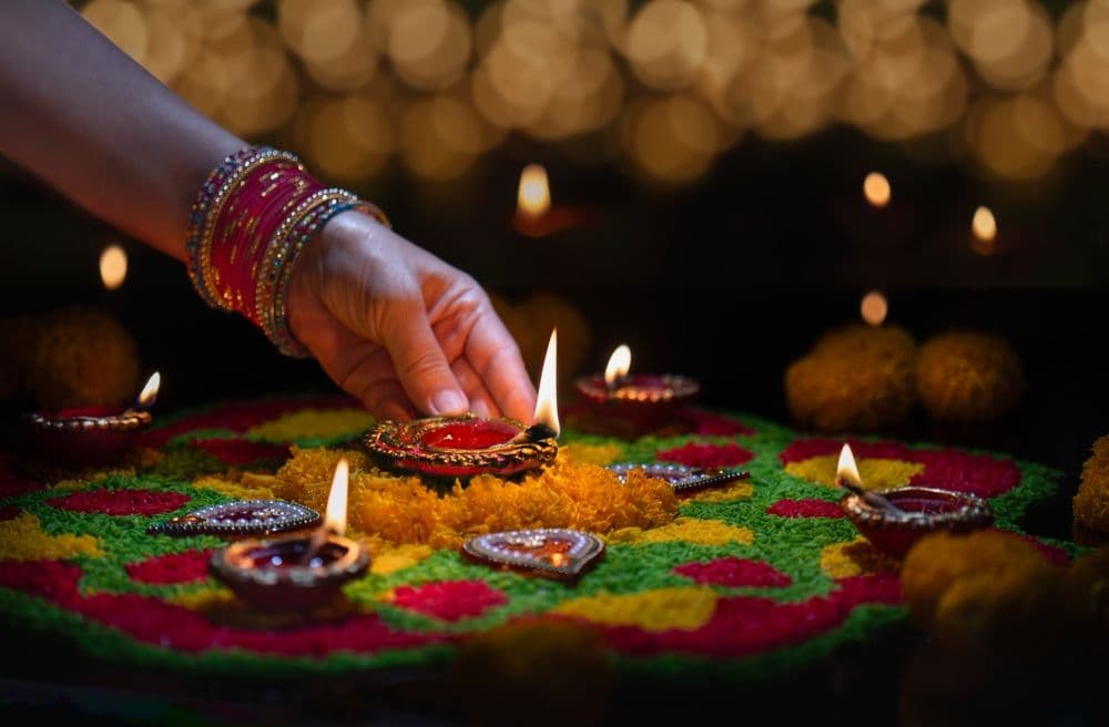 Clay diya lamps lit during diwali celebration, Diwali, or Deepavali, is India's biggest and most important holiday