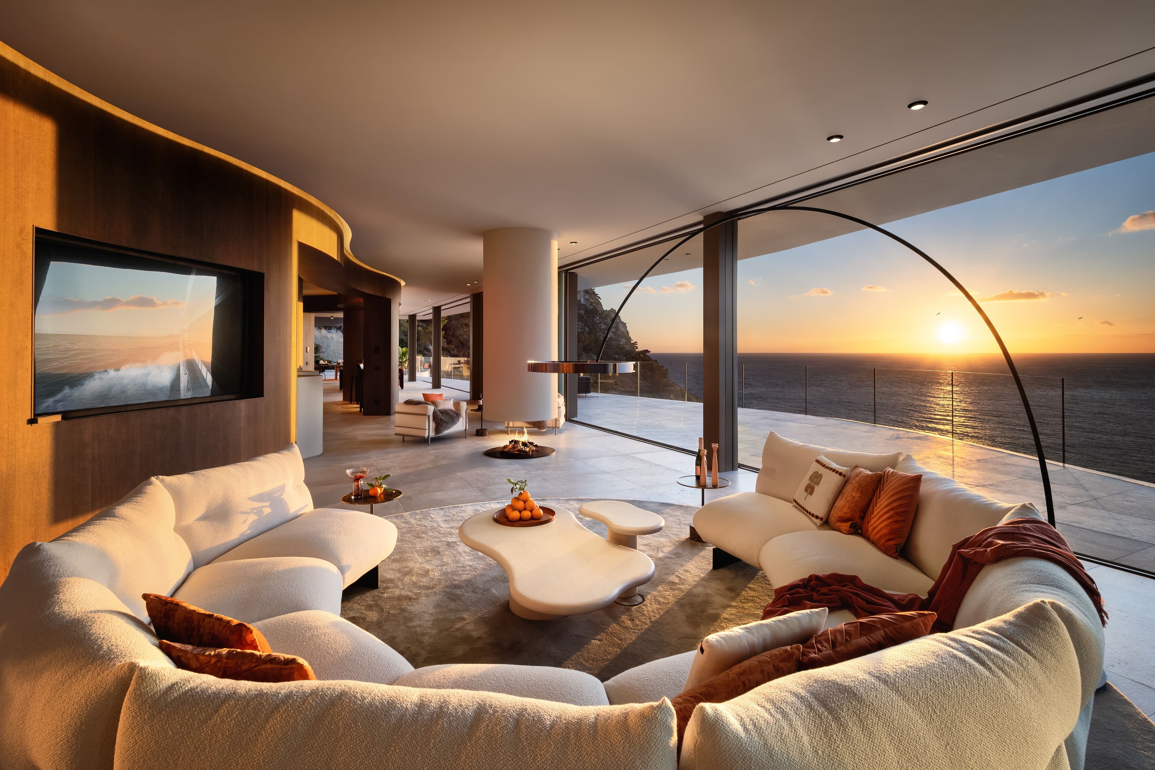 Round fireplace on upper level - an extraordinary focal point and connecting element in the centre of the upper level is the floating round fireplace. 