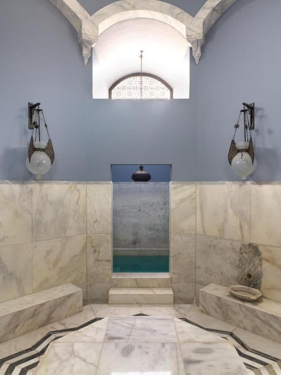 La Maison Bleue’s tranquil spa environment includes Turkish bath and plunge pools, offering guests a holistic wellness experience.