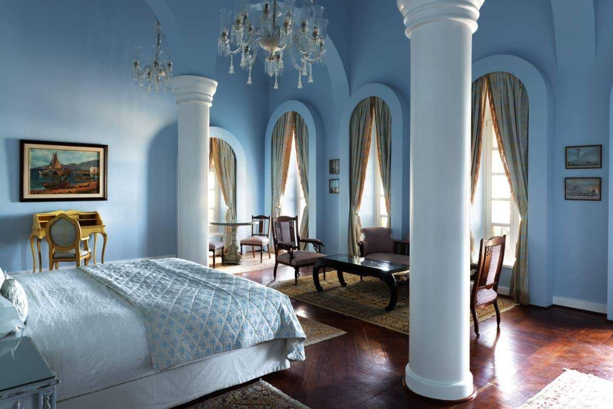 One of the individually designed suites showcases high ceilings, parquet floors and a seamless indoor–outdoor connection.