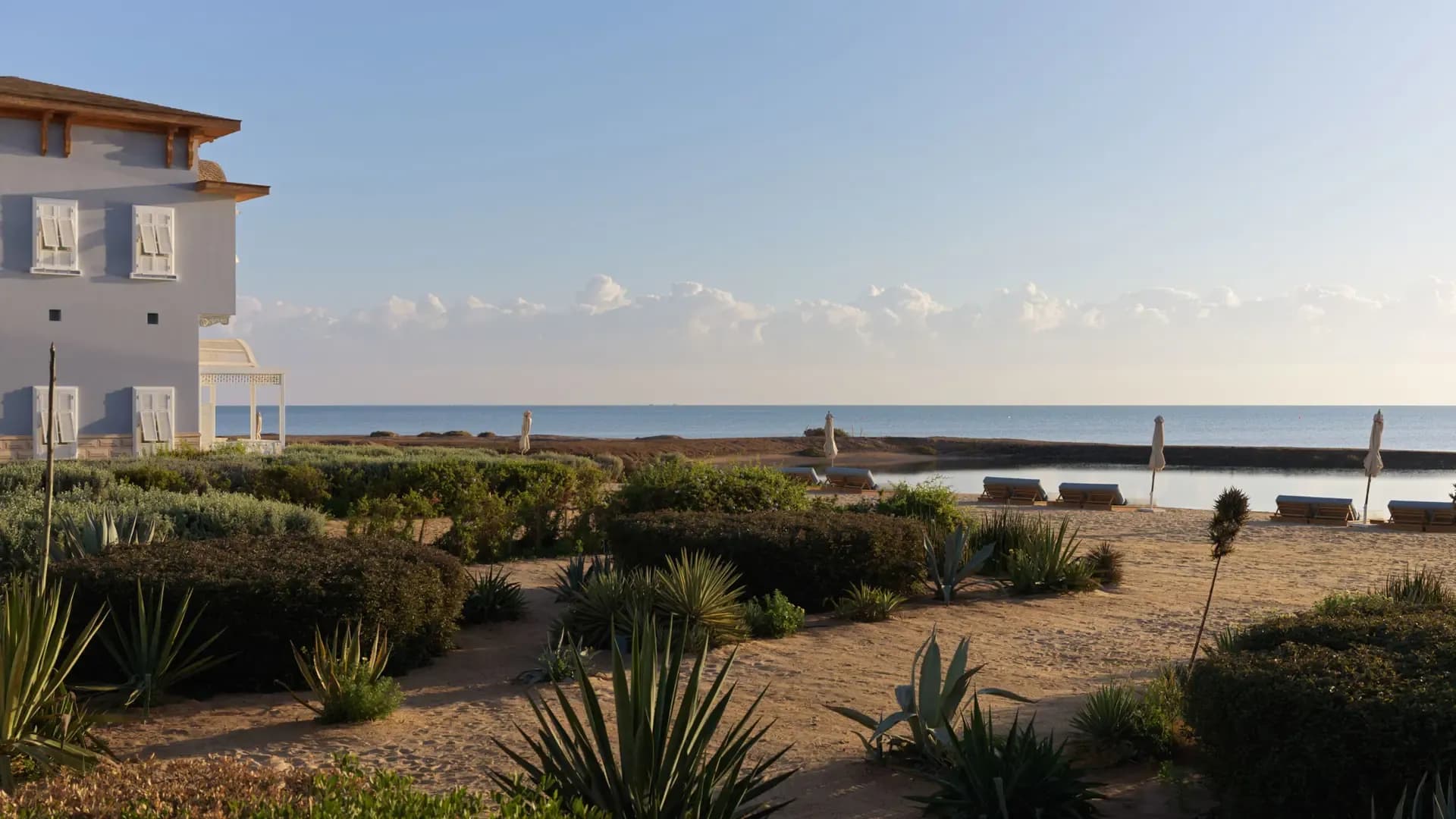 The beachfront setting of La Maison Bleue creates an intimate atmosphere where luxury meets the natural rhythm of the sea.