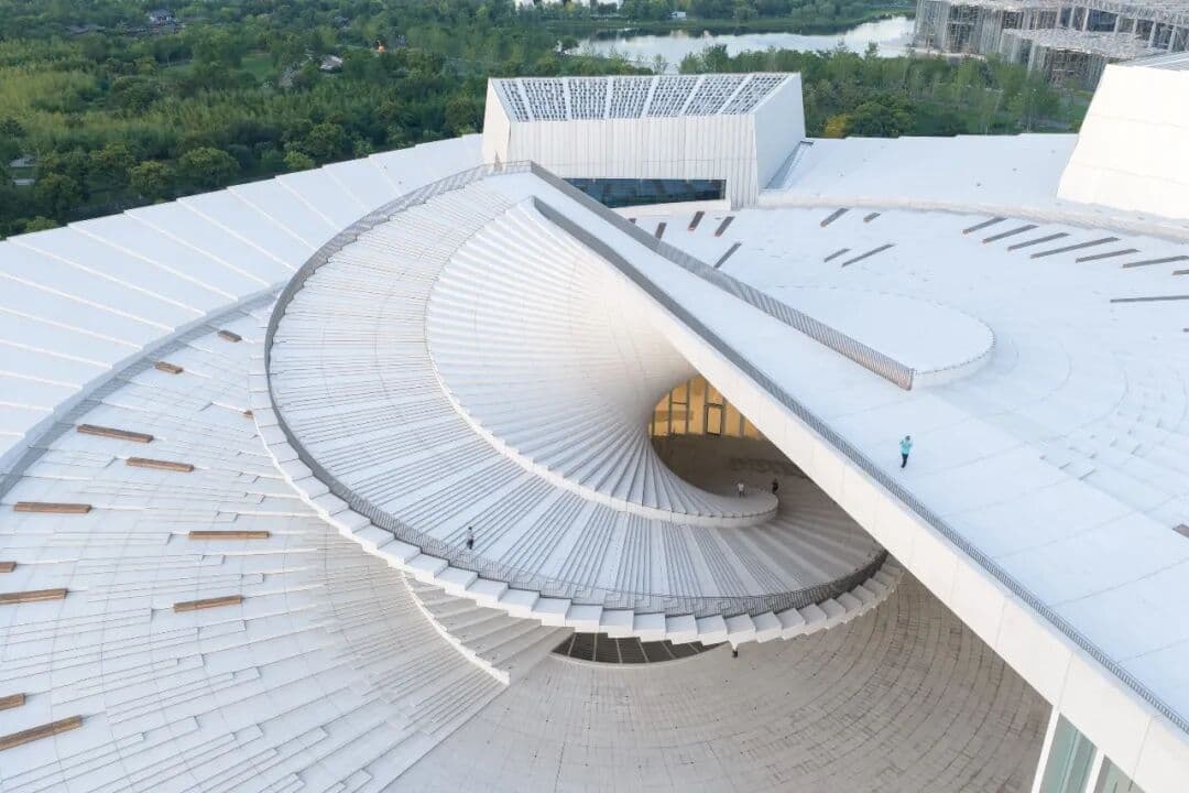 The double-helix staircase forms the centre of the opera house’s fan-shaped roof.