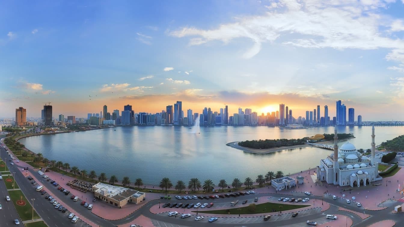 Skyline and residential developments in Sharjah as UAE investors drive more than half of the emirate's real estate trading value in H1 2026.