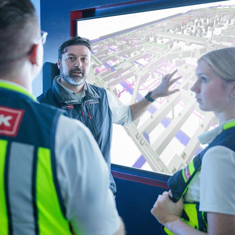 Suffolk project teams review a digital construction model as part of the company’s push to integrate AI and data-driven tools into jobsite workflows.