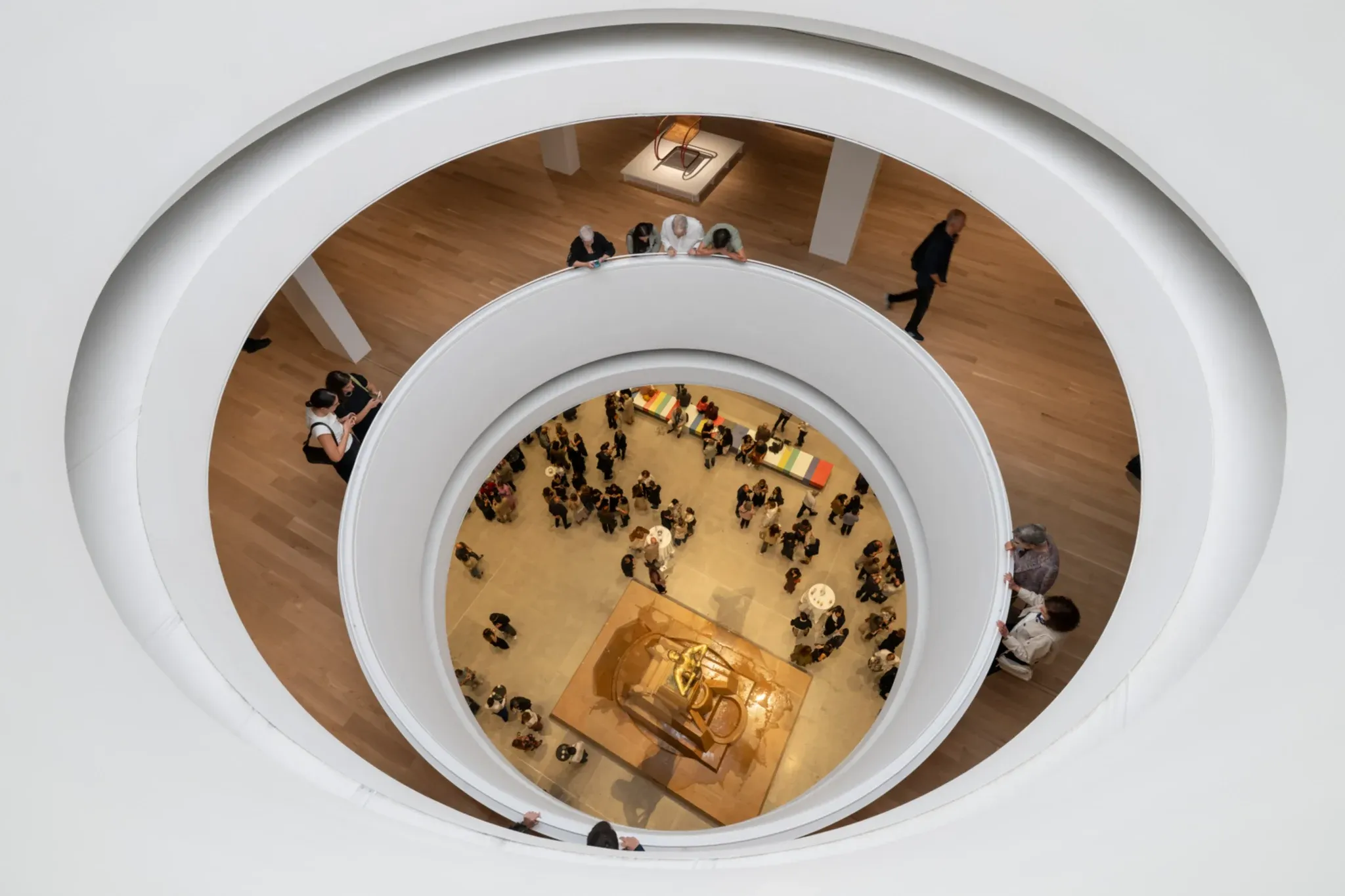 A circular opening creates views between the museum’s different levels.