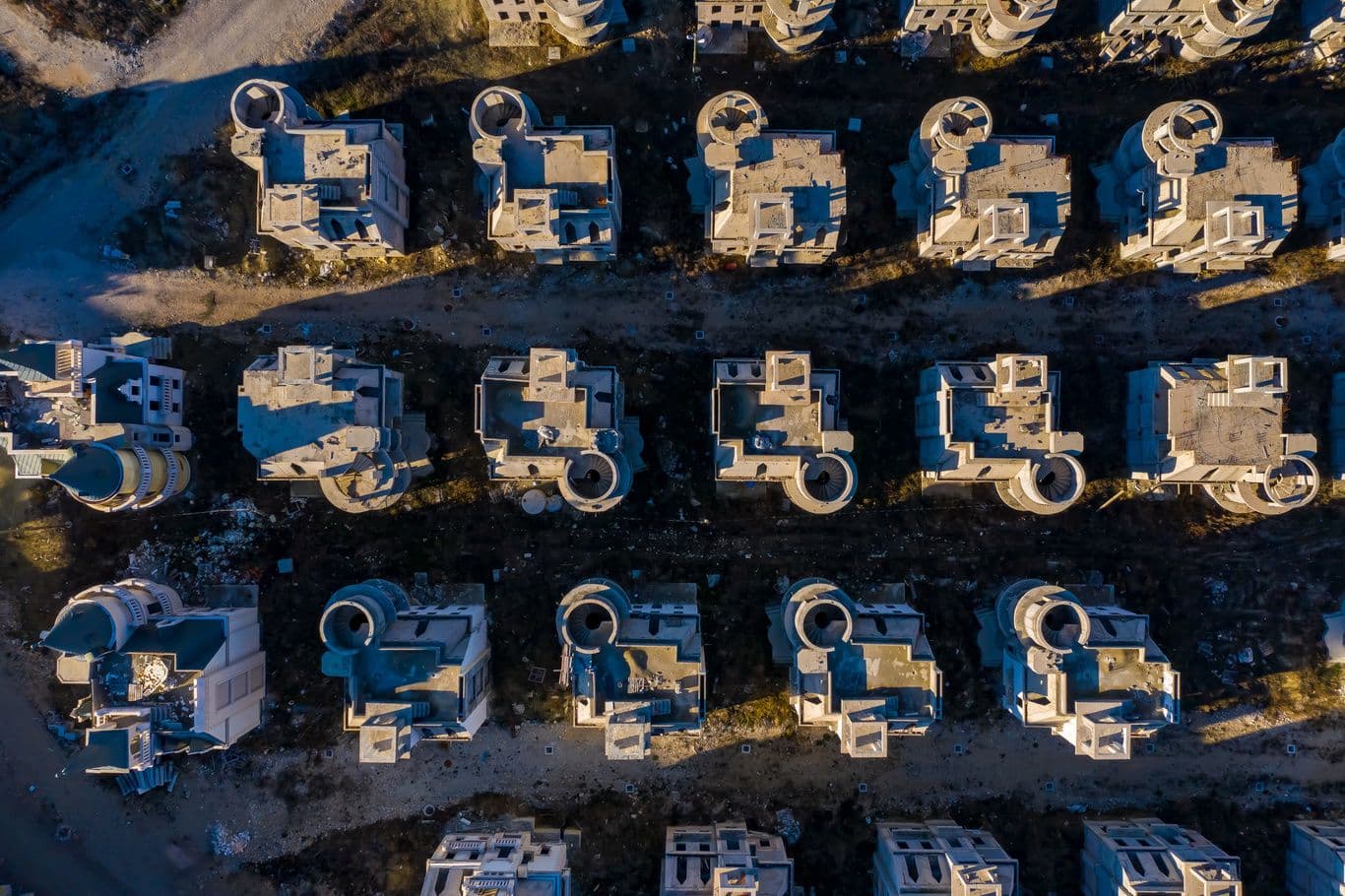 Aerial view of Burj Al Babas’ symmetrical layout and half-finished villas scattered with construction debris, Mudurnu, Bolu.
