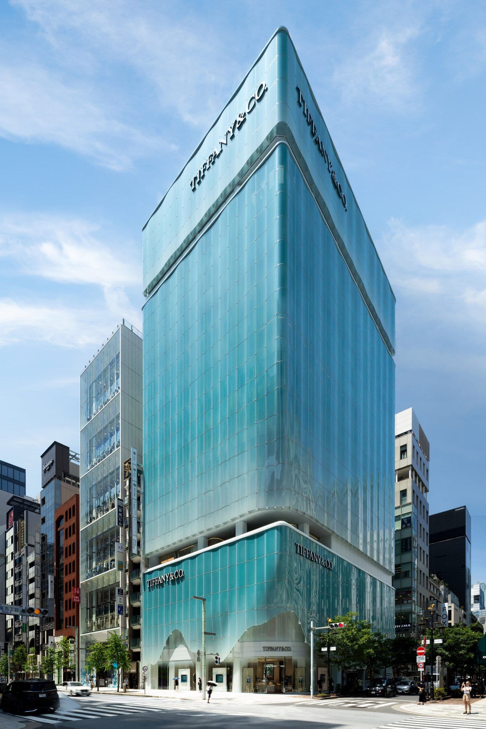 Across the 13-storey structure, the exterior is articulated in three stacked volumes defined by outdoor terraces and recesses. This creates a visual rhythm while distinguishing the varied programmes within.