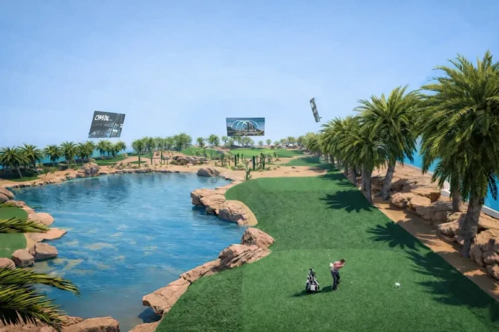 Artificial turf, real sand bunkers, and water hazards will recreate outdoor golf conditions inside a controlled architectural structure.