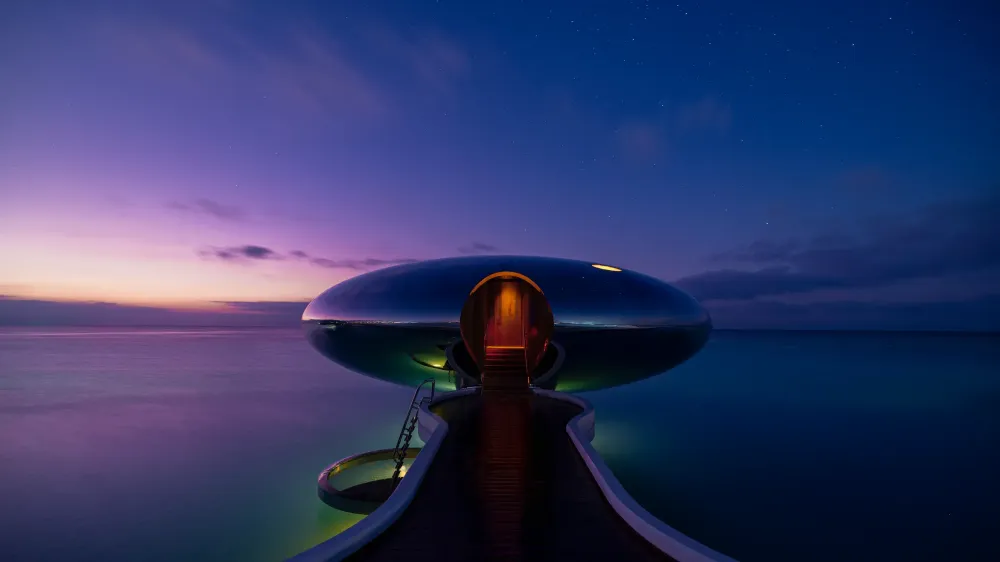 Stainless-steel overwater villas reflect the sky and sea, creating Shebara’s signature floating effect.