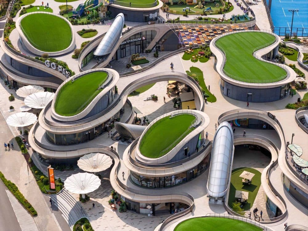 The multi-level complex is connected through raised ramps and pathways.