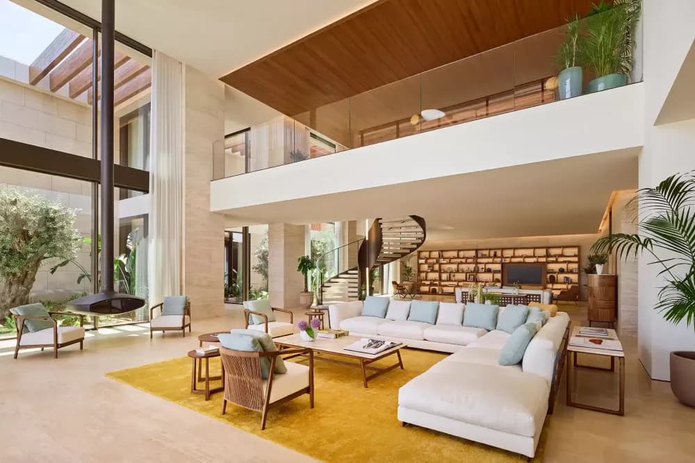 Interior finishes feature locally sourced travertine, honed marble and oiled teak, creating a warm, tactile environment rooted in place. Image: Bulgari Resorts & Mansions