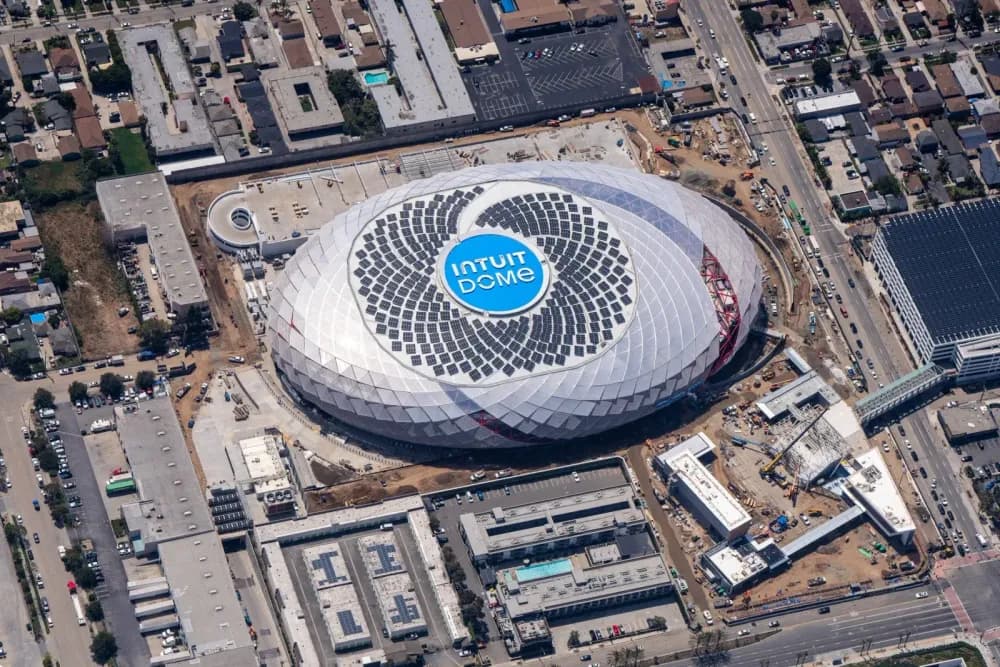 Rooftop solar panels and battery storage systems powering the Intuit Dome