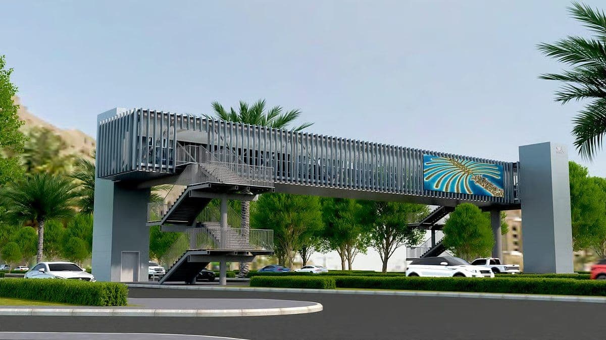Rendering of one of the two 40-metre pedestrian bridges planned on Palm Jumeirah, with stair towers, a lift core and a Palm Jumeirah graphic on its side