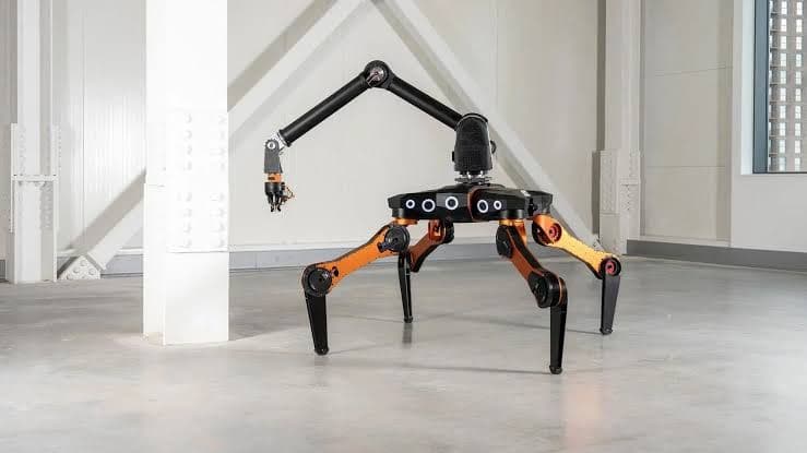 All3 Mantis equipped with its robotic working arm for automated construction tasks.