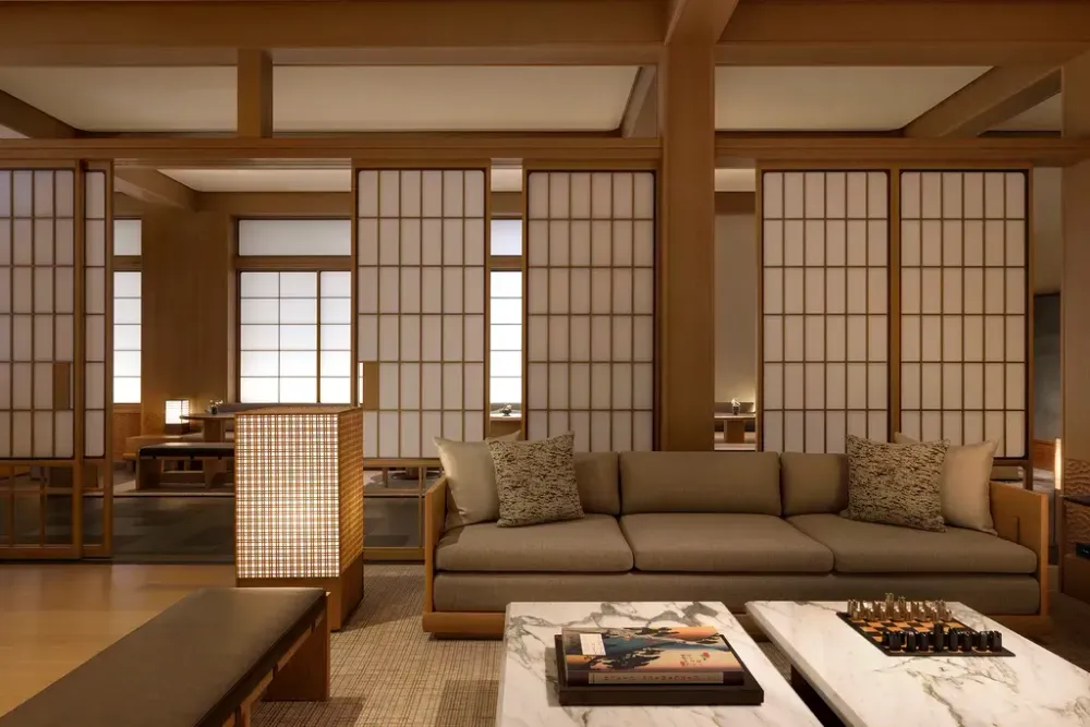 Capella Kyoto Hotel by Kengo Kuma & Associates draws on Kyoto’s machiya heritage through layered timber, filtered light and intimate spatial transitions.