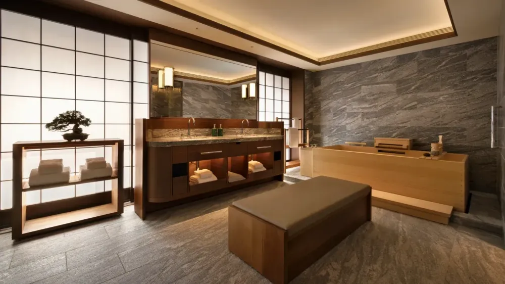 Capella Kyoto Hotel by Kengo Kuma & Associates draws on Kyoto’s machiya heritage through layered timber, filtered light and intimate spatial transitions.