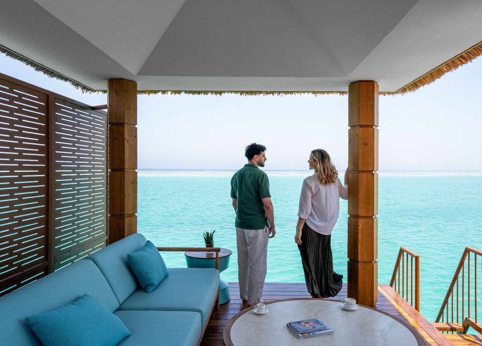 Guests enjoy uninterrupted Red Sea views from the private terrace of an overwater villa at Rixos Murjana.