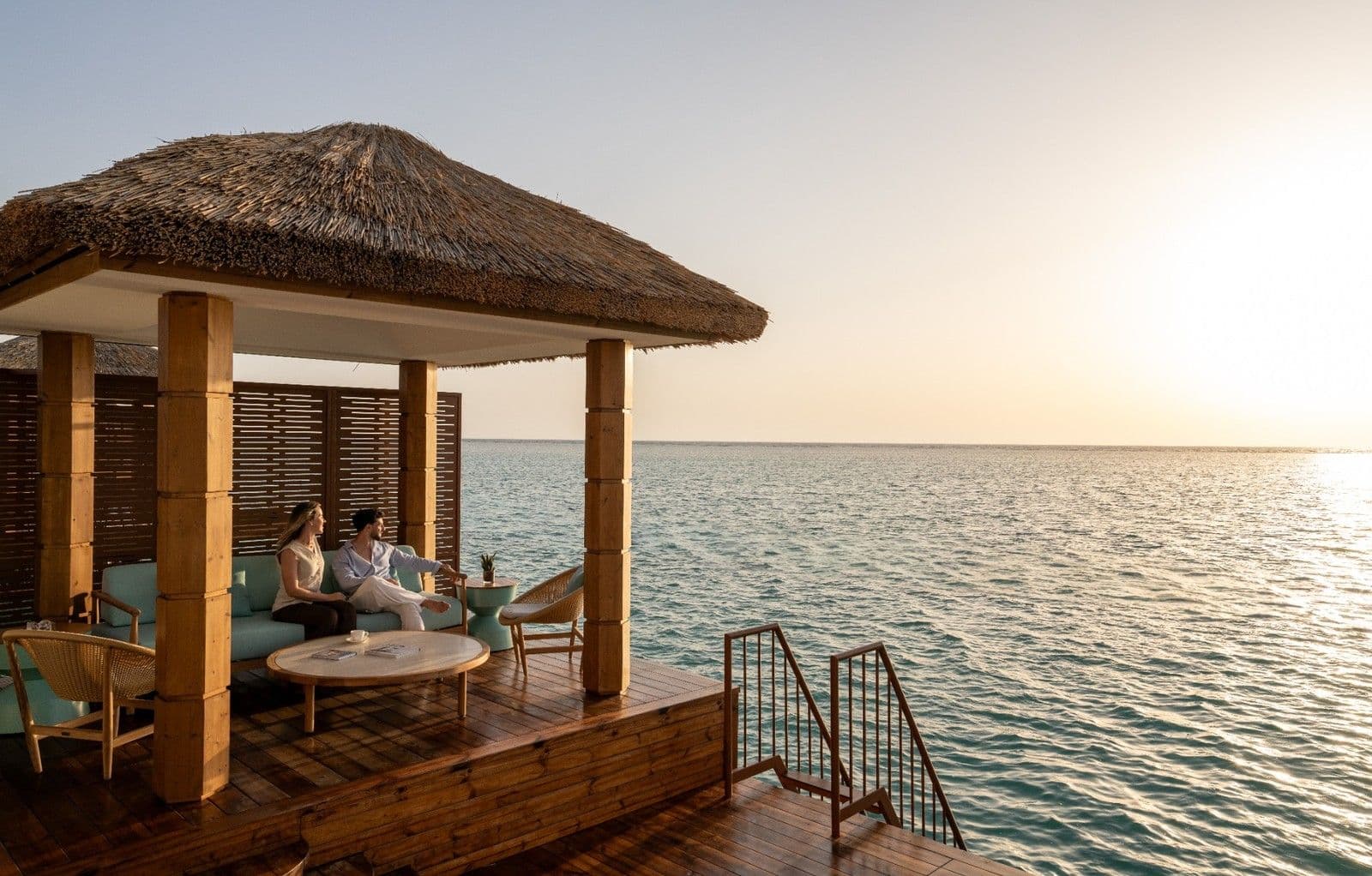 A private waterfront terrace at Rixos Murjana offers direct Red Sea access and open views from the Club Privé overwater villas.